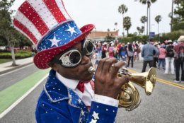 A trumpeter who went only by the name Lenny plays a tune during the Santa Monica Fourth of July parade Thursday, July 4, 2019 in Santa Monica, Calif. (AP Photo/Richard Vogel)