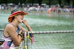 Guests wait along the Reflecting Pool for President Donald Trump's 'Salute to America' event honoring service branches on Independence Day, Thursday, July 4, 2019, in Washington. President Donald Trump is promising military tanks along with "Incredible Flyovers &amp; biggest ever Fireworks!" for the Fourth of July. (AP Photo/Andrew Harnik)