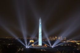 In this photo provided by NASA, the 50th anniversary of the Apollo 11 mission is celebrated in a 17-minute show, "Apollo 50: Go for the Moon" which combined full-motion projection-mapping artwork on the Washington Monument and archival footage to recreate the launch of Apollo 11 and tell the story of the first moon landing, Friday, July 19, 2019, in Washington. (NASA/Bill Ingalls via AP)