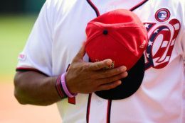 WASHINGTON, DC - JULY 04: Manager Dave Martinez #4 of the Washington Nationals listens to the National Anthem before a game against the Miami Marlins at Nationals Park on July 4, 2019 in Washington, DC. (Photo by Patrick McDermott/Getty Images)