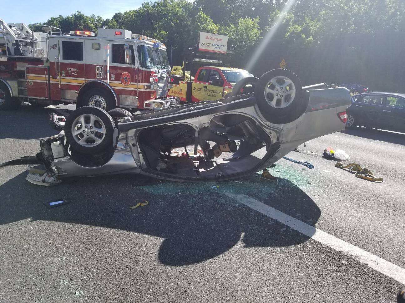 An overturned vehicle delayed rush hour traffic on the Capital Beltway in Bethesda Monday. (Courtesy Pete Piringer)