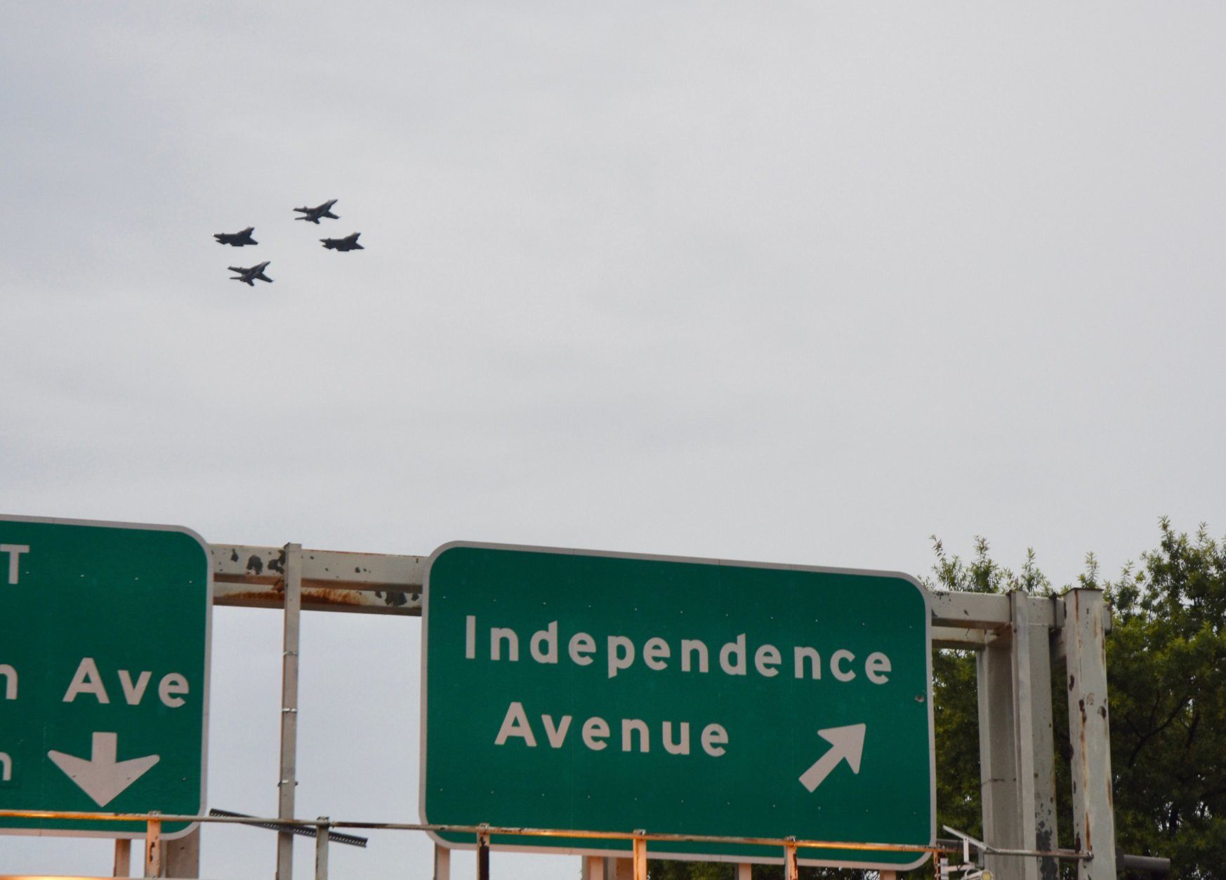 Military planes fly over Independence Avenue in D.C. Thursday evening. (WTOP/Dave Dildine)