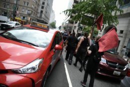 Far-left antifa protesters march down Washington, D.C.’s F Street on July 6, 2019, in an attempt to disrupt a far-right rally in Freedom Plaza. Trump supporters and anti-fascist organizers held dueling rallies across the street from each other, leading to high tensions as D.C. and U.S. Park Police largely held the peace. (WTOP/Alejandro Alvarez)