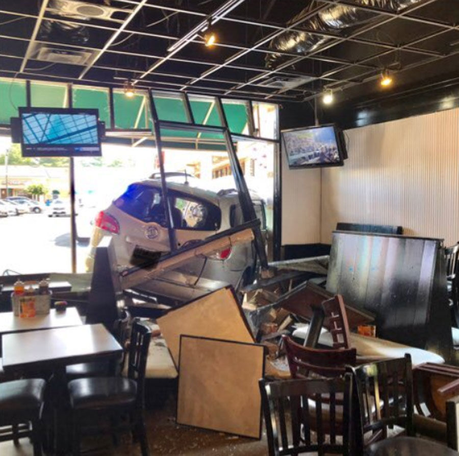<p>The van crashed into the restaurant.</p>
