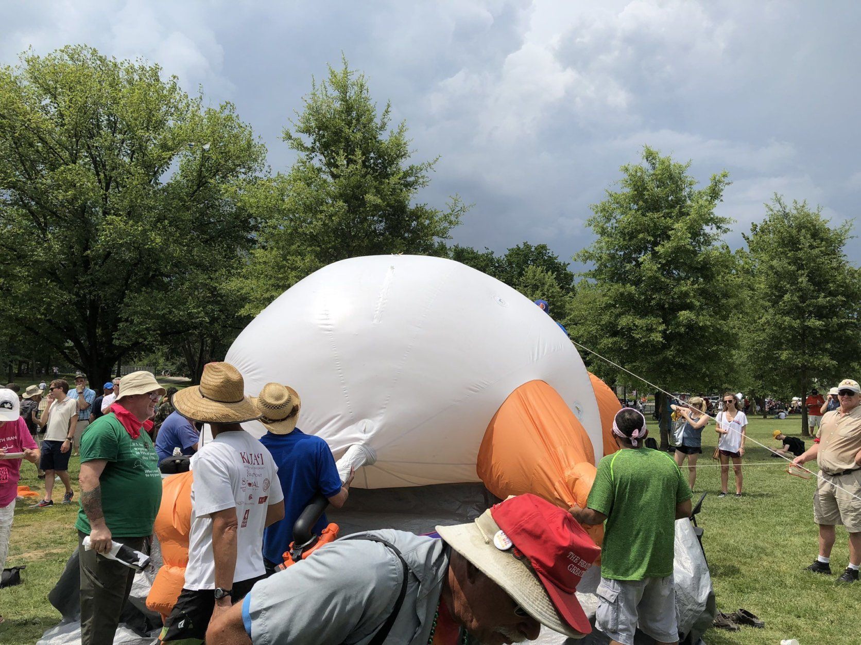 The "Baby Trump" blimp is being deflated ahead of wet weather in Washington on Thursday, July 4, 2019. (WTOP/Mike Murillo)