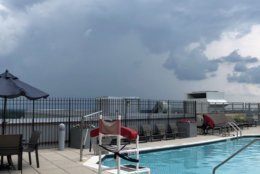 Here's a view of storm clouds from a D.C.-area rooftop pool on Thursday, July 4, 2019. (Courtesy @snazzzyredhead via Twitter)
