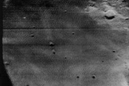This is the Apollo 11 primary landing site as seen from the hatch window of the spacecraft and telecast back to earth on July 19, 1969. (AP Photo/NASA)