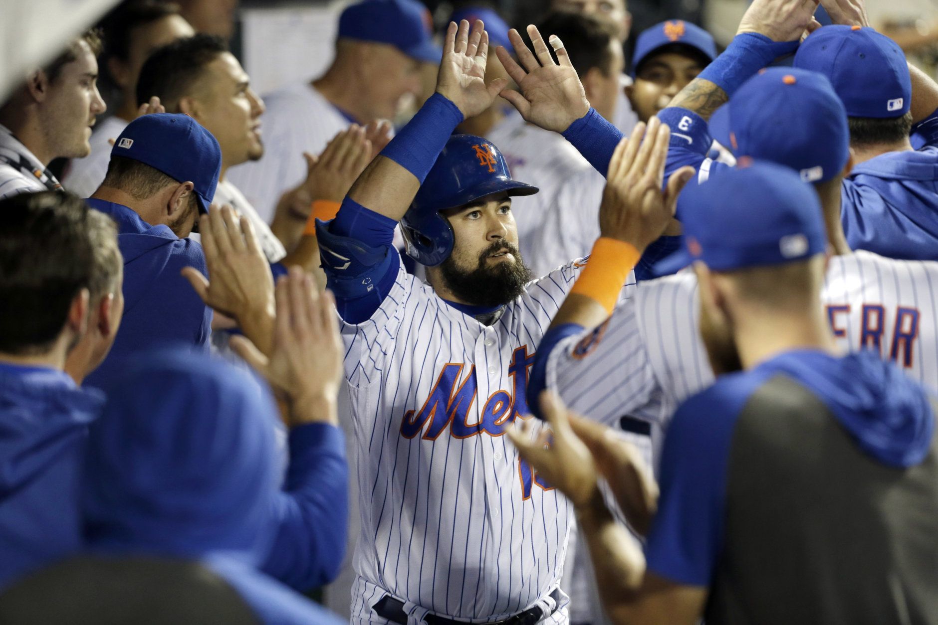 New York Mets' Luis Guillorme is greeted by teammates after hitting a home run during the eighth inning of a baseball game against the Washington Nationals, Saturday, Aug. 10, 2019, in New York. (AP Photo/Seth Wenig)
