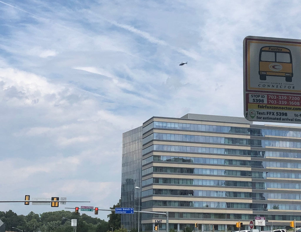 A helicopter is seen circling the area after of the Gannett building on Wednesday, Aug. 7, 2019.