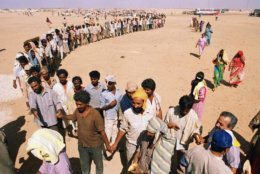 <p>On August 2, 1990, Iraq invaded Kuwait, seizing control of the oil-rich emirate. (The Iraqis were later driven out in Operation Desert Storm.)</p>
<p>Refugees from Iraq&#8217;s invasion of Kuwait line up for bread at Ruweishid, Jordan, Sept. 3, 1990. (AP Photo/Jeff Widener)</p>
