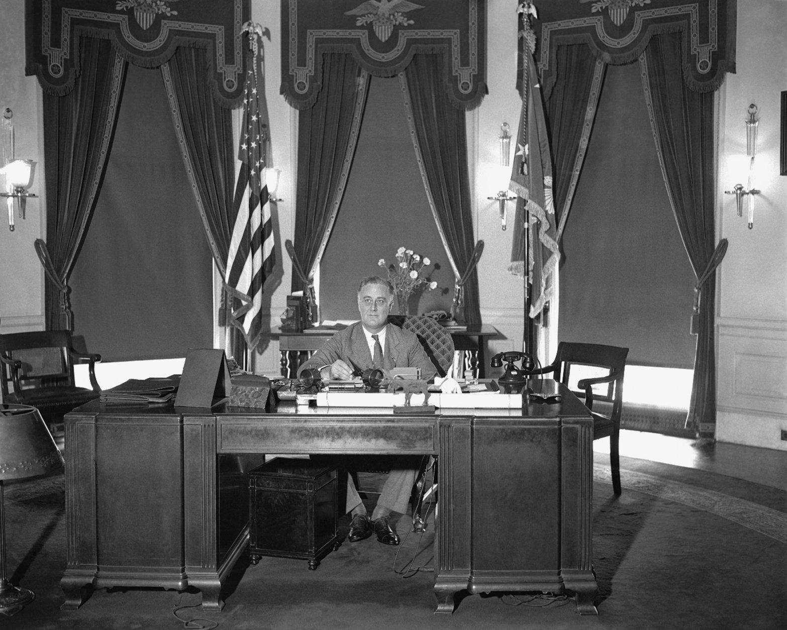 <p>In 1939, President Roosevelt signed the Hatch Act, which prohibited civil service employees from taking an active part in political campaigns.</p>
<p>President Franklin D. Roosevelt is shown at his desk at the White House, May 27, 1933. (AP Photo)</p>
