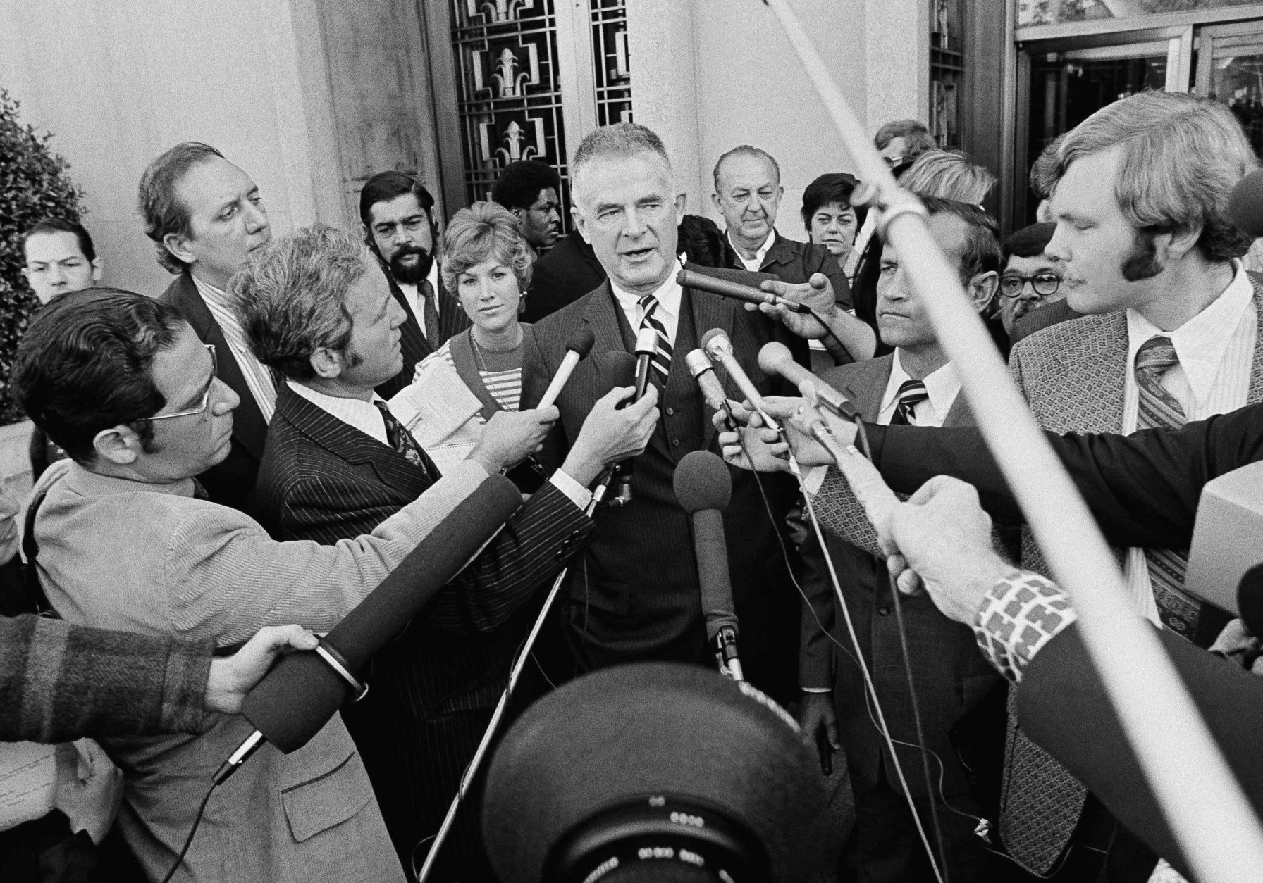<p>In 1974, former White House counsel John W. Dean III was sentenced to one to four years in prison for obstruction of justice in the Watergate cover-up. (Dean ended up serving four months.)</p>
<p>Special Watergate prosecutor Archibald Cox is surrounded by newsmen outside D.C. District Court in Washington on Friday, Oct. 19, 1973, after ousted White House counsel John W. Dean III pleaded guilty to conspiring to obstruct the Watergate investigation. Cox said he further charges would be brought with the exception of perjury if Dean&#8217;s testimony proves false. (AP Photo)</p>
