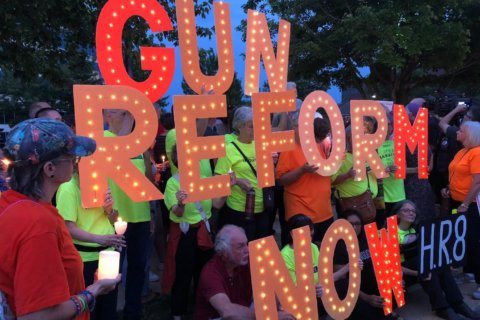 Mass shootings prompt vigil outside NRA headquarters in Fairfax