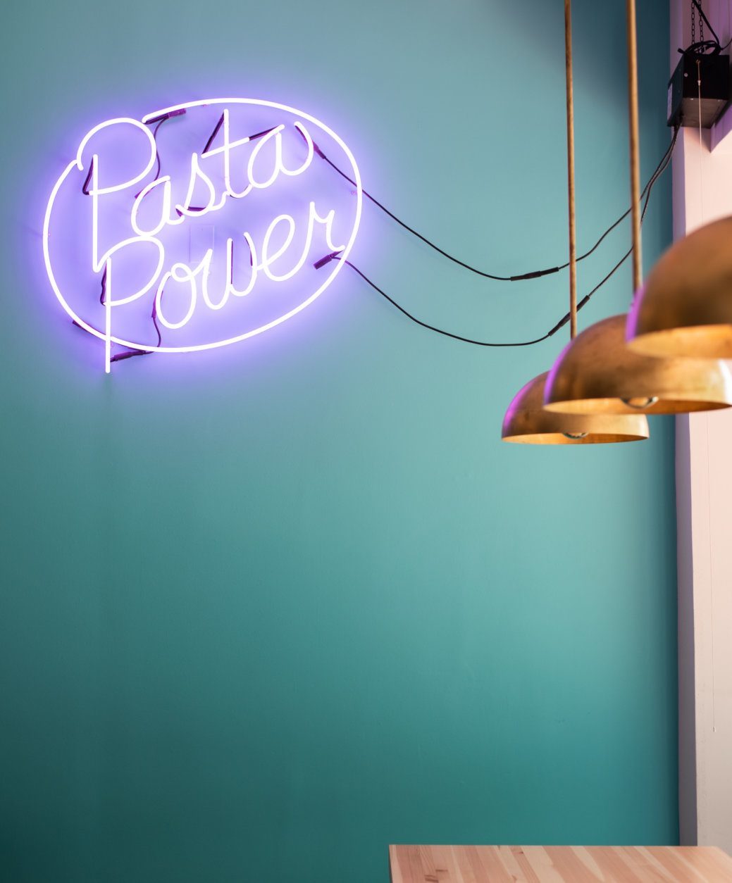 Neon sign reads "Pasta Power"