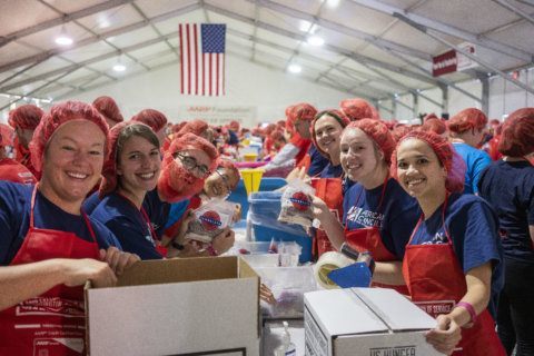 Volunteers take to National Mall to pack 1 million meals for seniors