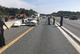 Authorities say it appears the plane was attempting to land at the nearby airport when it crashed into a car on the highway.