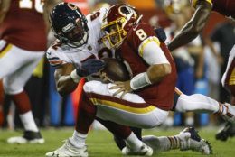 Chicago Bears linebacker Khalil Mack (52) hits Washington Redskins quarterback Case Keenum (8) during the first half of an NFL football game Monday, Sept. 23, 2019, in Landover, Md. (AP Photo/Patrick Semansky)