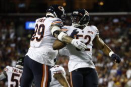 Chicago Bears linebackers Aaron Lynch (99) and Khalil Mack (52) celebrate Mack's hit to cause a fumble by the Washington Redskins during the first half of an NFL football game Monday, Sept. 23, 2019, in Landover, Md. (AP Photo/Patrick Semansky)