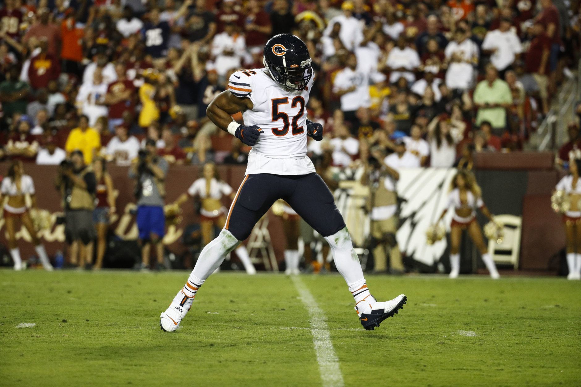 Chicago Bears outside linebacker Khalil Mack (52) celebrates his hit to cause a fumble during the first half of an NFL football game against the Washington Redskins, Monday, Sept. 23, 2019, in Landover, Md. (AP Photo/Patrick Semansky)