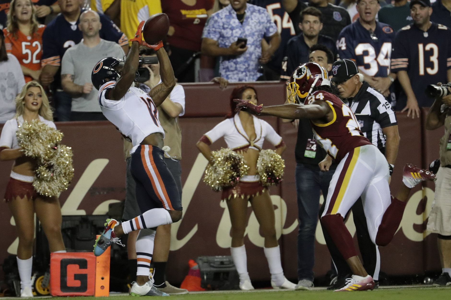 Chicago Bears wide receiver Taylor Gabriel (18) catches a pass for a touchdown in front of Washington Redskins cornerback Josh Norman (24) during the first half of an NFL football game Monday, Sept. 23, 2019, in Landover, Md. (AP Photo/Julio Cortez)