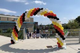 A balloon archway greets visitors at one stretch of Adams Morgan Day festivities.
