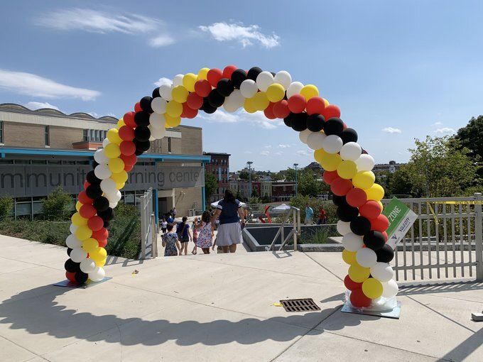 A balloon archway greets visitors at one stretch of Adams Morgan Day festivities.