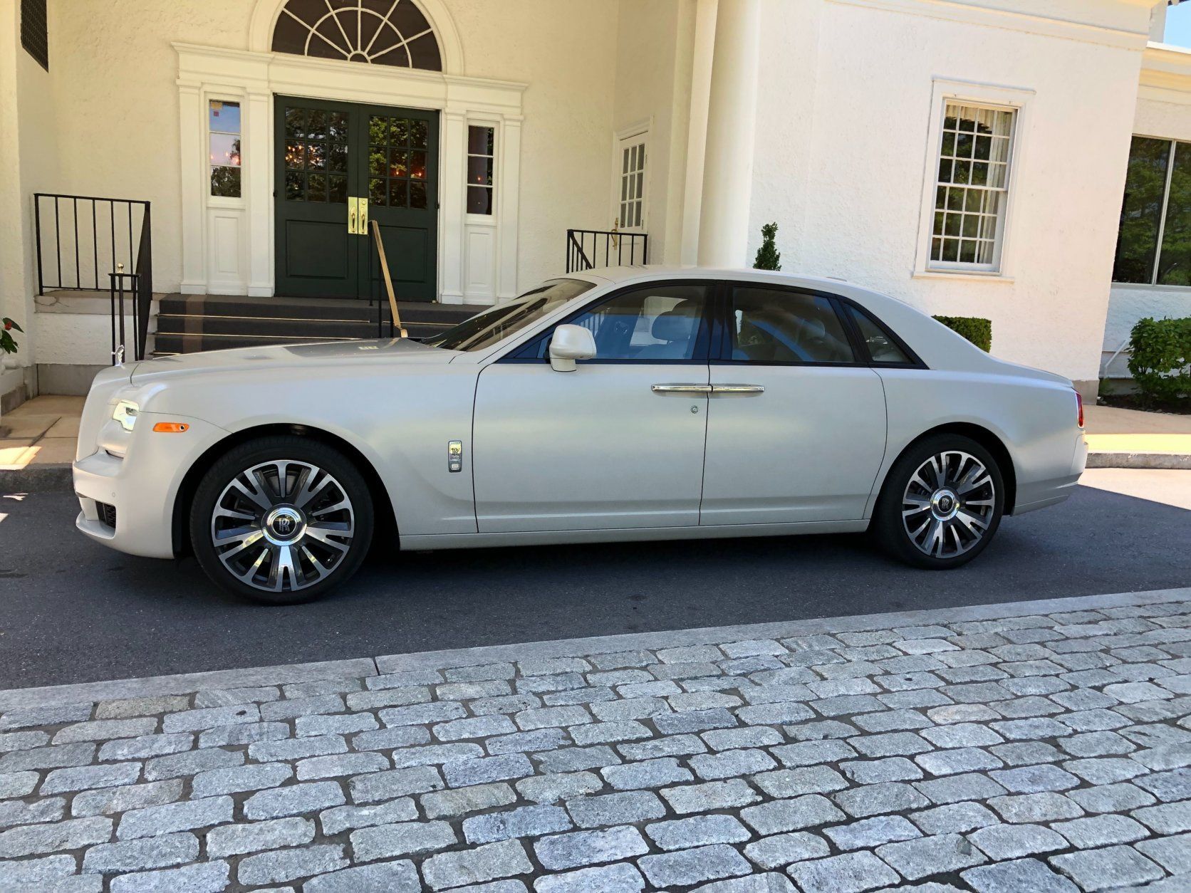 <p>Nothing else really has the same presence as a Rolls-Royce, and even the smaller Ghost stands out in the crowd. This Rolls is still a large car and sits high with a taller roof line.</p>
<p>The car is long and the coach doors with the front and rear door handles close together as a focal point.</p>
<p>Large 21-inch wheels adorn the sedan and the center cap with RR always stays upright.</p>
<p>Rolls-Royce allows you to customize most of the car. Paint color like the $20,700 Iced Selby Grey with an iced clearcoat does especially well in making a statement.</p>
