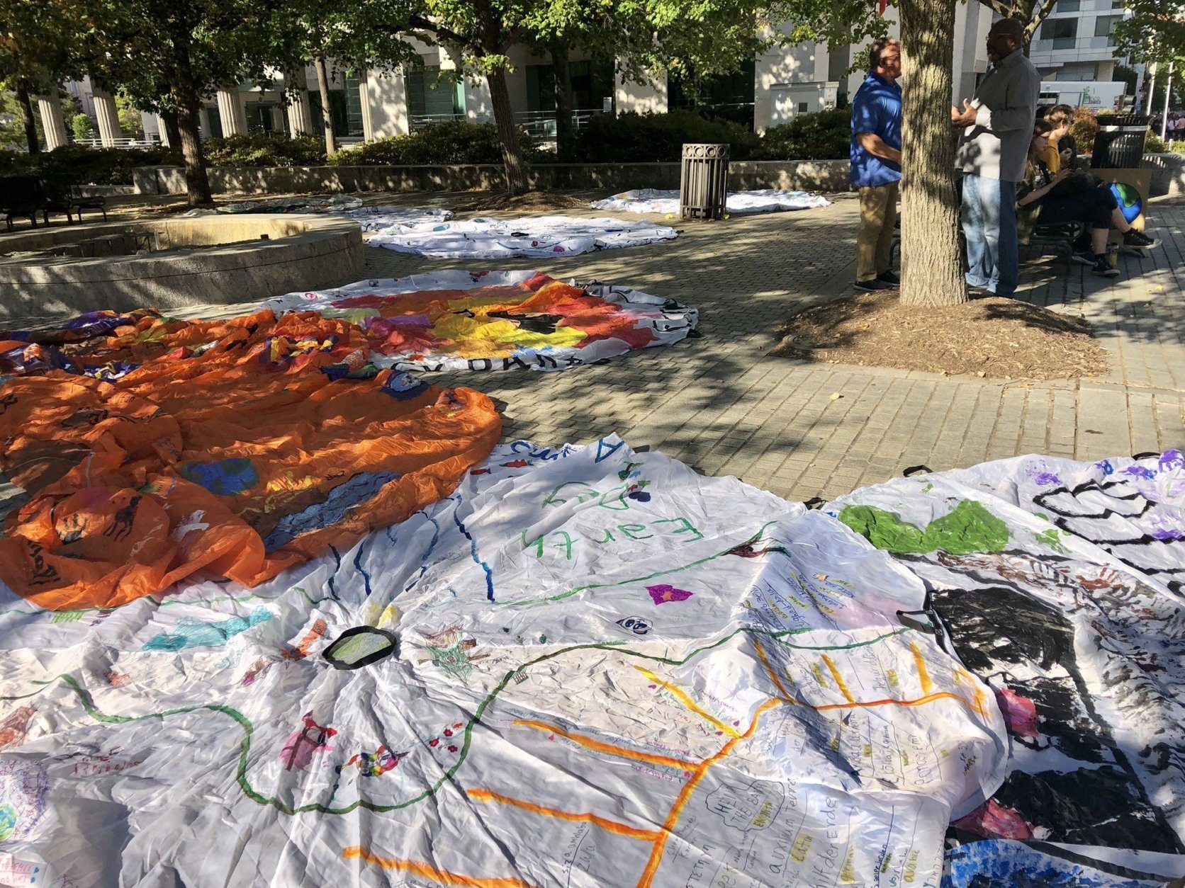 Climate protesters brought decorated parachutes to the area around the Newseum, in D.C., before the beginning of the march. 