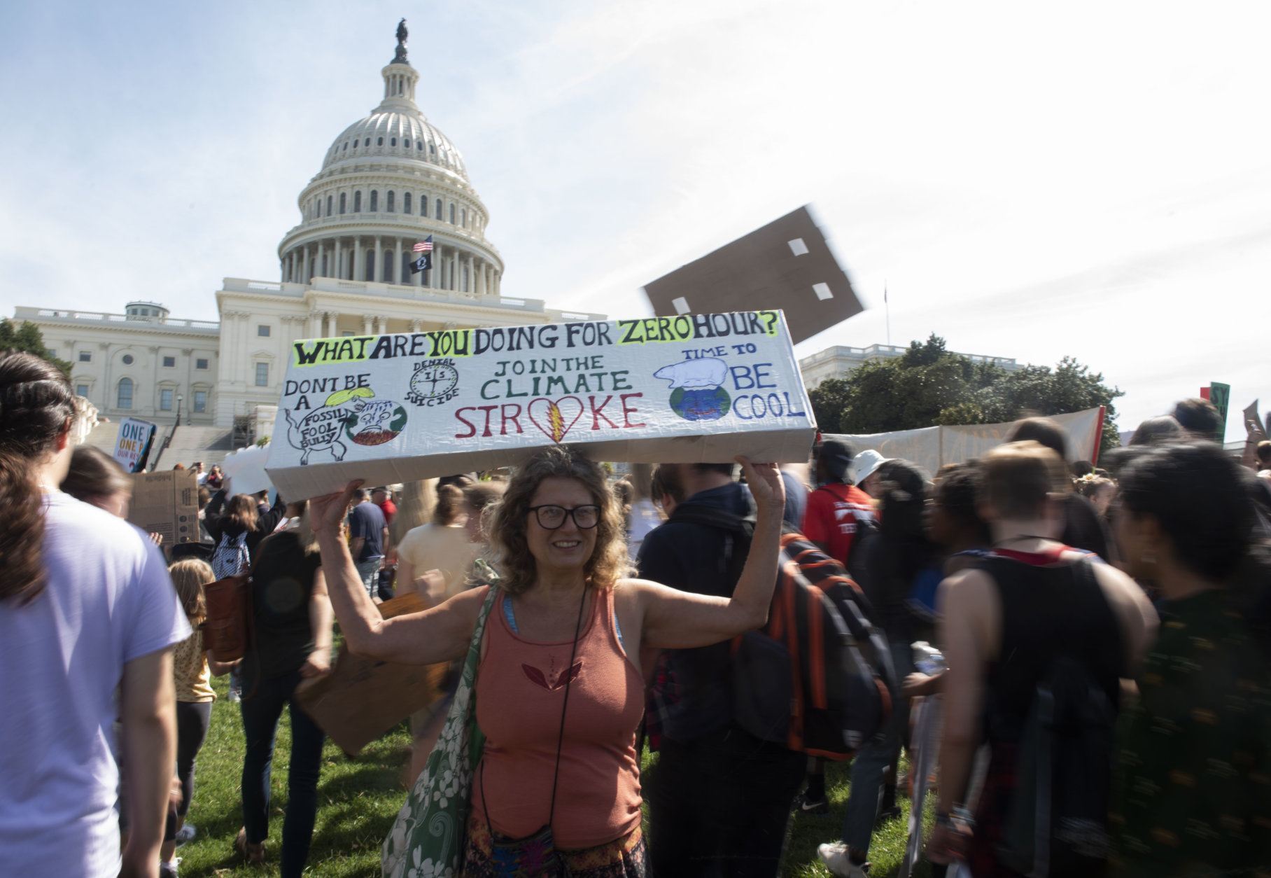 Angela Flynn, of Washington, holds a sign as she demonstrate at the march to the U.S. Capitol during the Climate Strike Friday, Sept. 20, 2019, in Washington. (AP Photo/Kevin Wolf)