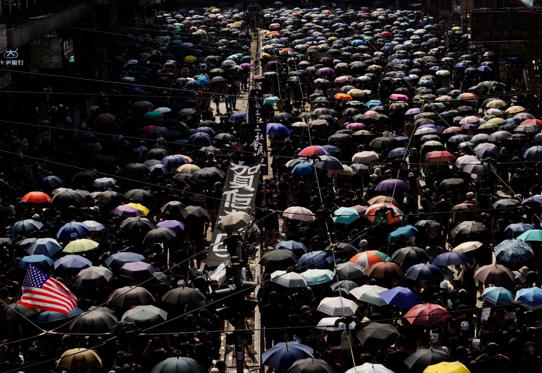 anti-government protesters hold umbrellas in hong kong