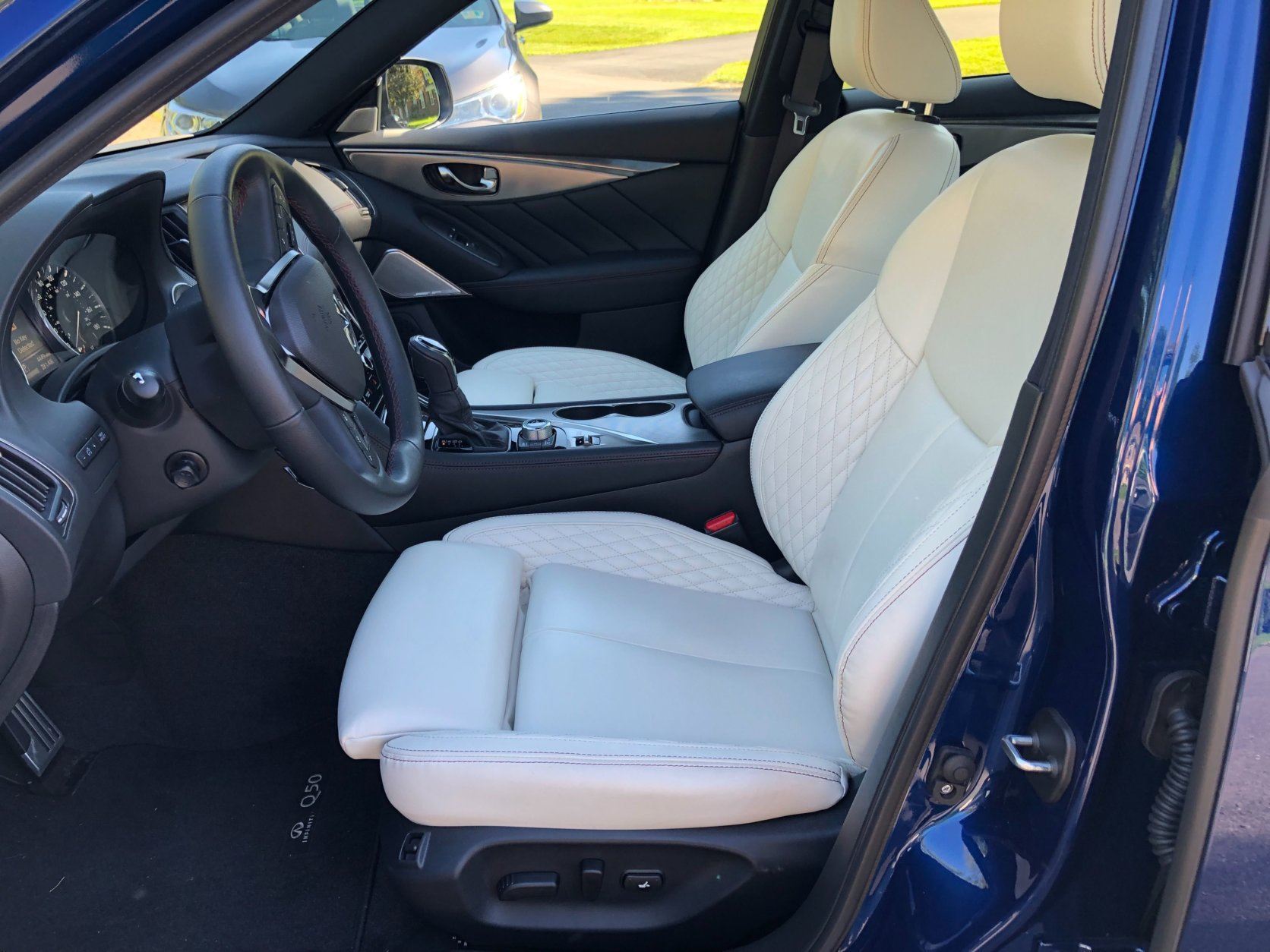 <p>The inside of the Infiniti Q50 appears a bit plain when compared to some other luxury sedans. With high quality, quilted Semi-aniline leather and red interior stitching, it still makes for a comfortable ride. The aluminum trim is also a very nice touch.</p>
