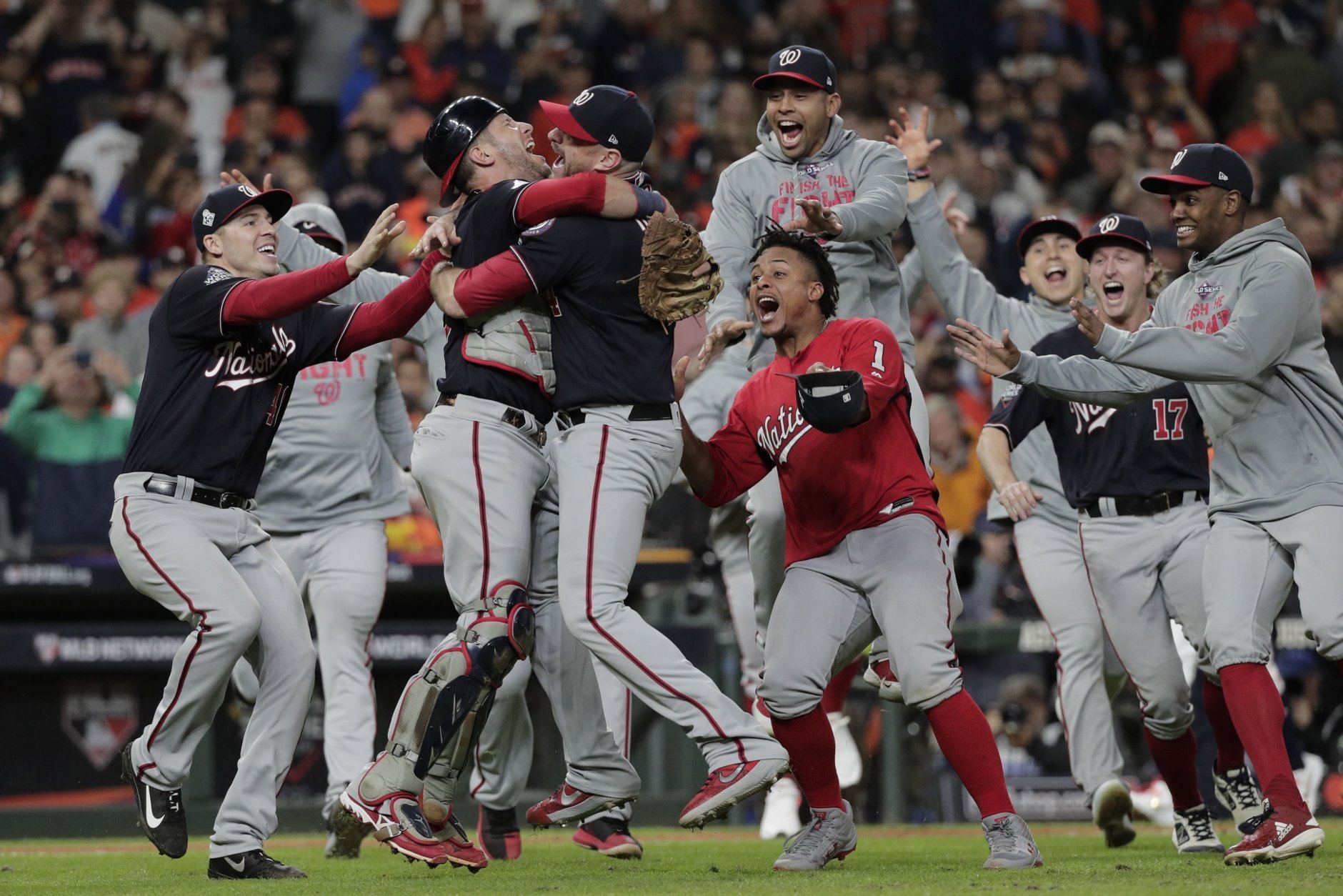 Washington Nationals' Yan Gomes and Daniel Hudson celebrate after Game 7 of the baseball World Series against the Houston Astros Wednesday, Oct. 30, 2019, in Houston. The Nationals won 6-2 to win the series. (AP Photo/David J. Phillip)