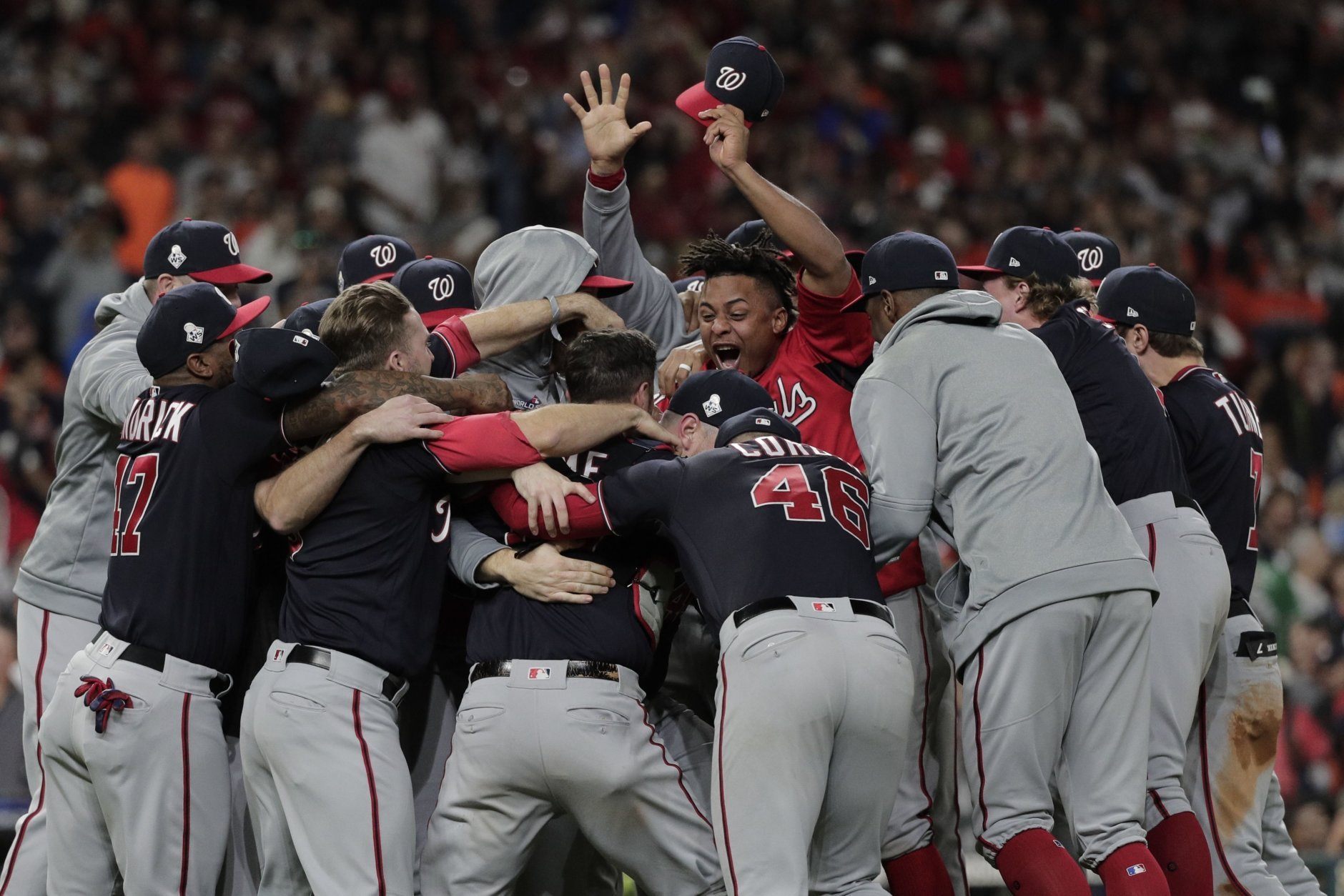 The Washington Nationals celebrate after Game 7 of the baseball World Series against the Houston Astros Wednesday, Oct. 30, 2019, in Houston. The Nationals won 6-2 to win the series. (AP Photo/David J. Phillip)