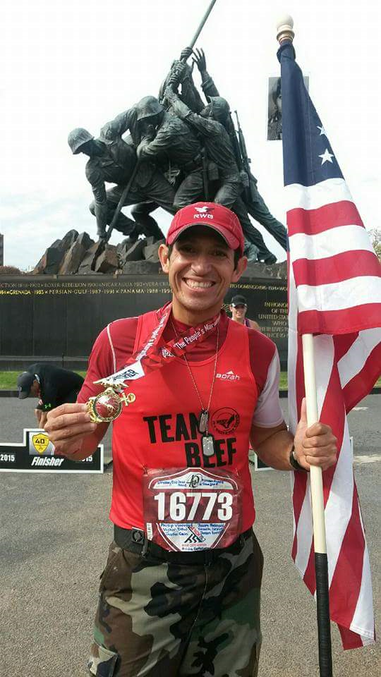 Jorge Garcia with flag and Iwo Jima memorial