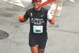 jorge garcia running with flag