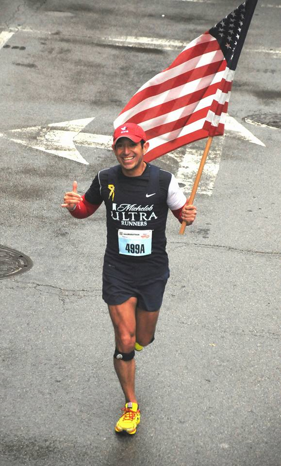 jorge garcia running with flag