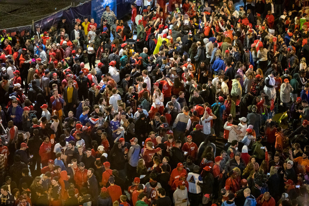 WASHINGTON, DC - OCTOBER 30: Washington Nationals fans stream into the streets outside of Nationals Park celebrating the Nationals World Series victory on October 30, 2019 in Washington, DC. The Washington Nationals defeated the Houston Astros 6-2 in Game 7 of the World Series bringing home the first World Series Championship in franchise history and the first to Washington, DC since 1924. (Photo by Samuel Corum/Getty Images)