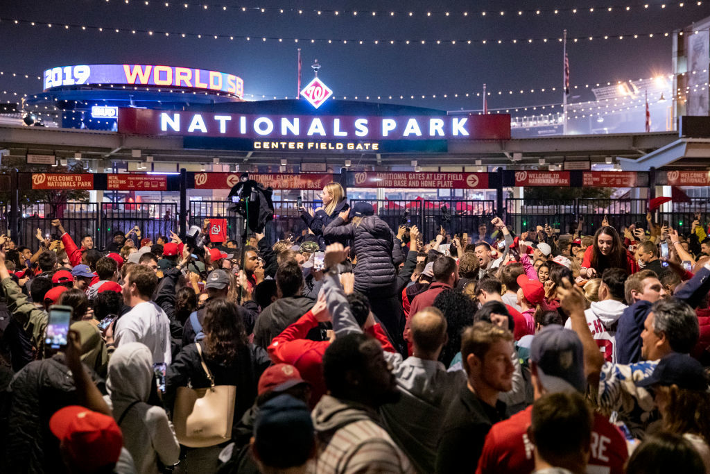 WASHINGTON, DC - OCTOBER 30: Washington Nationals fans stream into the streets outside of Nationals Park celebrating the Nationals World Series victory on October 30, 2019 in Washington, DC. The Washington Nationals defeated the Houston Astros 6-2 in Game 7 of the World Series bringing home the first World Series Championship in franchise history and the first to Washington, DC since 1924. (Photo by Samuel Corum/Getty Images)