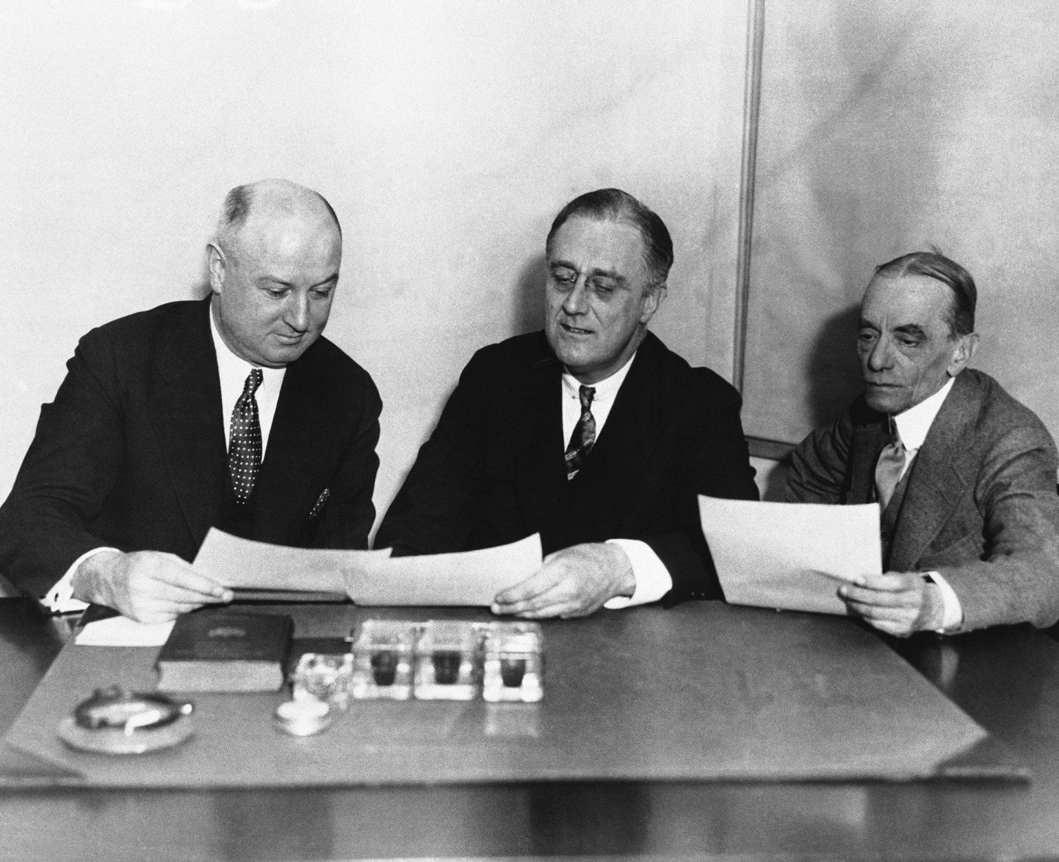 James A. Farley, left, joins New York Gov. Franklin D. Roosevelt and Louis Howe shown in April 1932.  Roosevelt with manager and secretary.  No other information available.  (AP Photo)