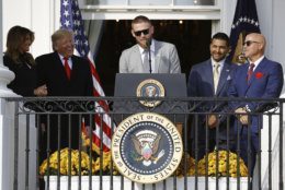 Washington Nationals starting pitcher Stephen Strasburg, center, speaks in front of first lady Melania Trump, from left, President Donald Trump, manager Dave Martinez and general manager Mike Rizzo during an event to honor the 2019 World Series champion Nationals baseball team at the White House, Monday, Nov. 4, 2019, in Washington. (AP Photo/Patrick Semansky)