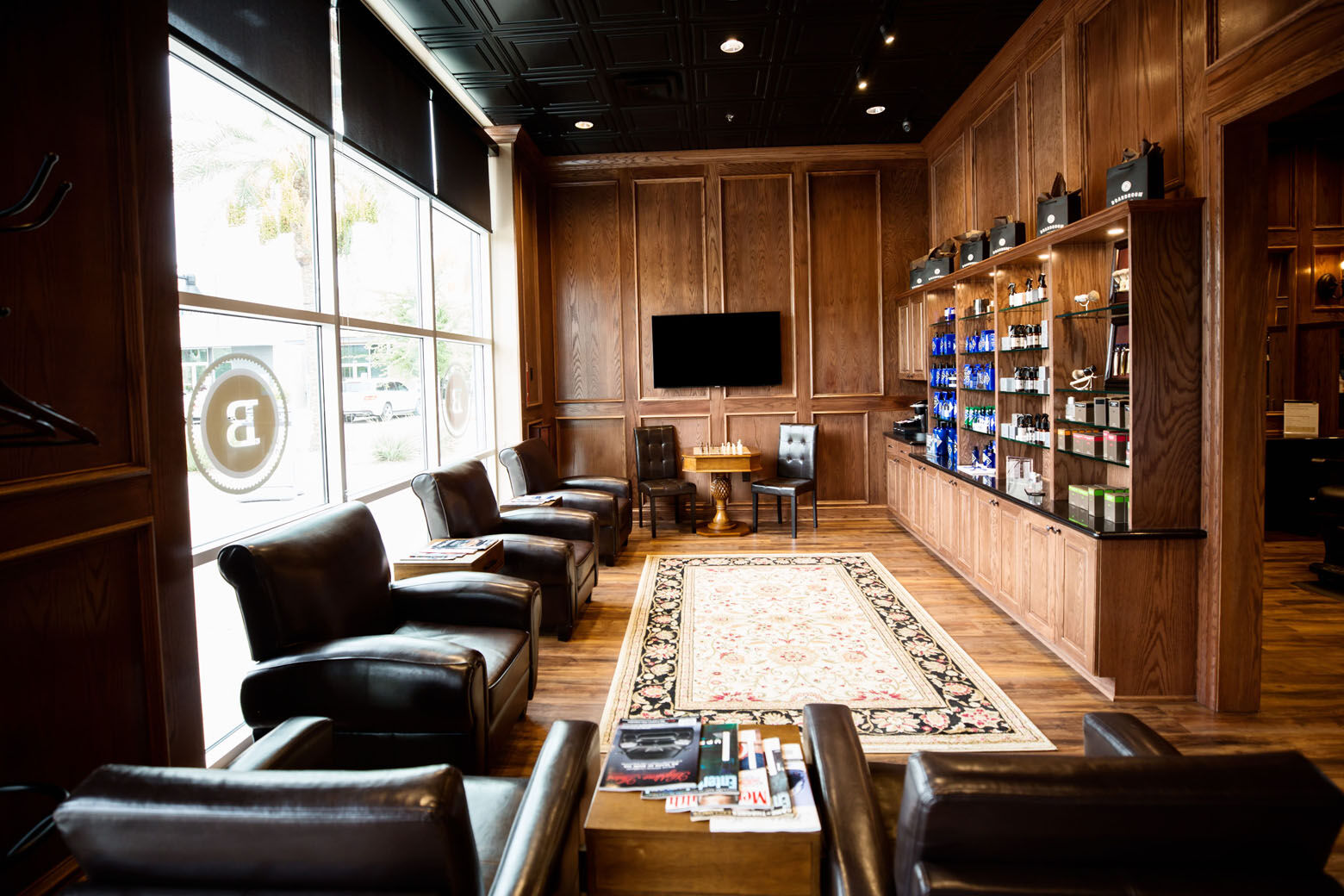 Boardroom Salons, as much leather-chaired lounges as barbershops, provides what it calls a "country club experience." Services offered include hair and shave services, manicures, and facial massages, along with complimentary drinks