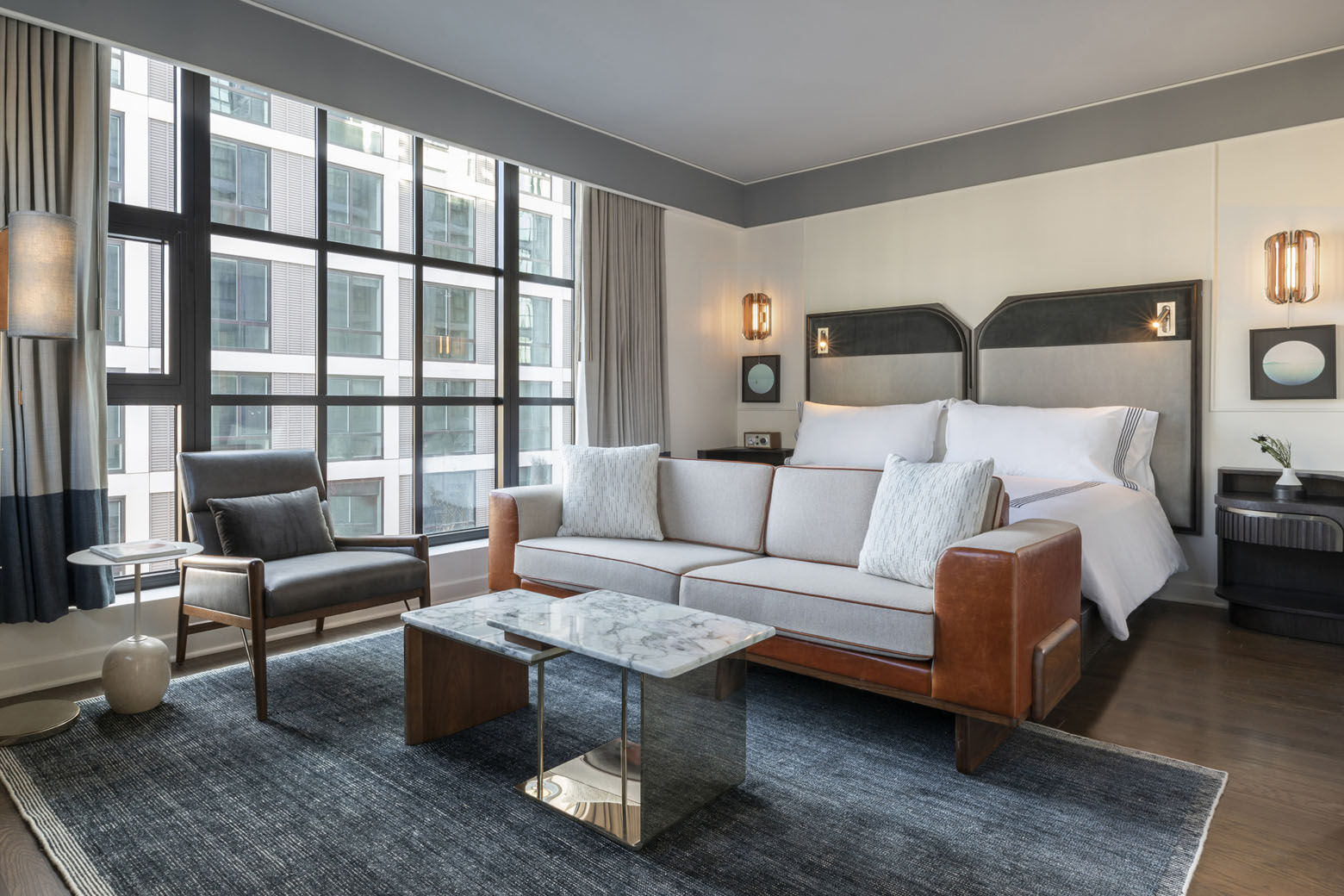 A look at the bedroom in a suite at the Thompson D.C. in the Capitol Riverfront's Navy Yard Neighborhood. The hotel's 225 rooms and suites all have floor-to-ceiling windows and views of the Anacostia River and Nationals Park.