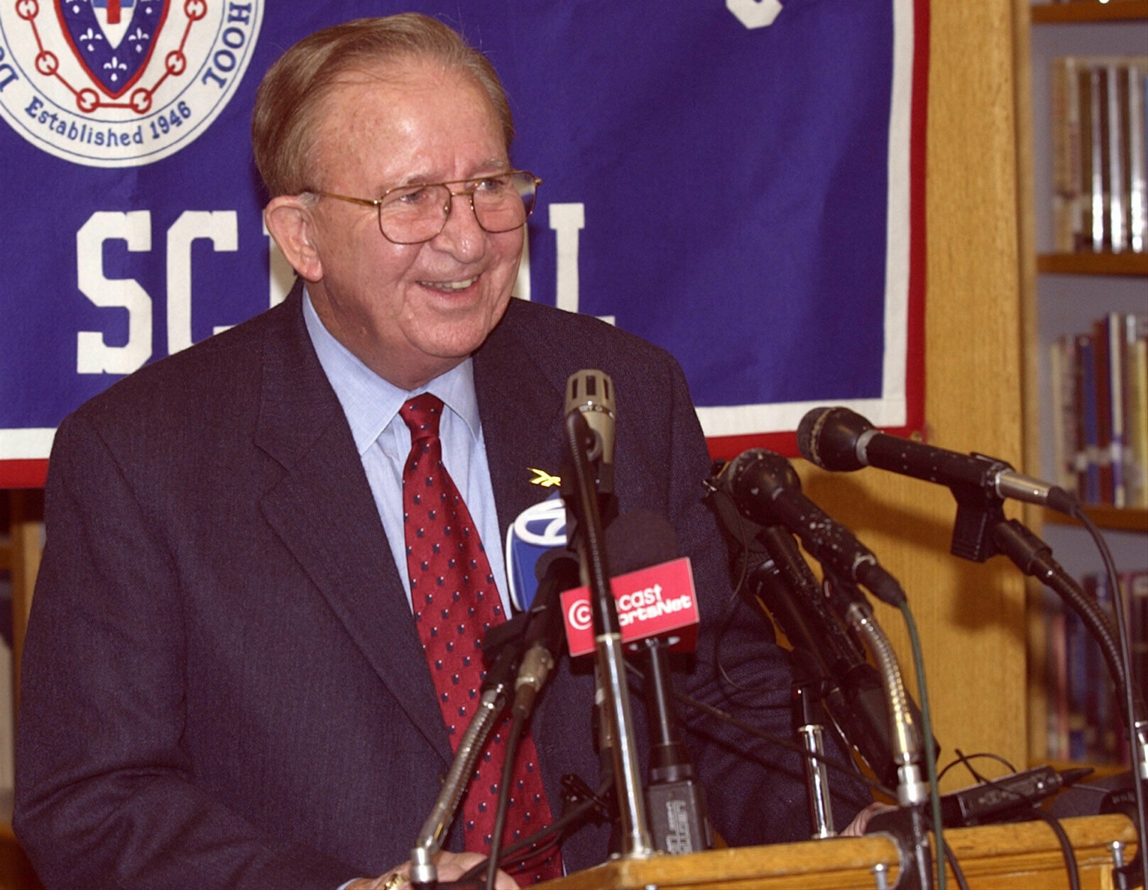 Morgan Wootten, head basketball coach at DeMatha High School smiles at a press conference to announce his stepping down as coach, Wednesday, Nov. 6, 2002, in Hyattsville, Md. Wootten's career record is 1,274-192. (AP Photo/Nick Wass)