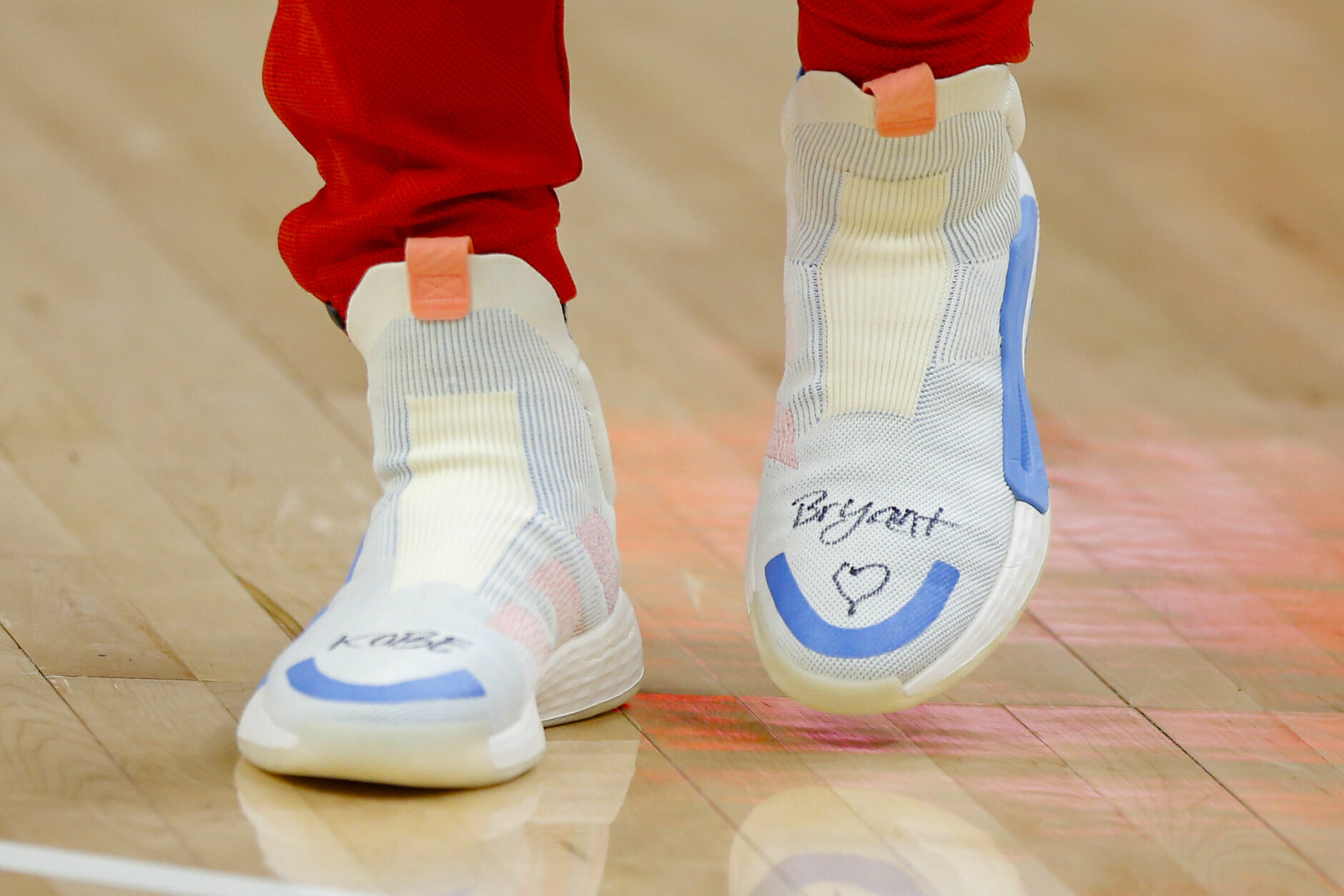 Atlanta Hawks guard Trae Young's (11) shoes honors Kobe Bryant prior to an NBA basketball game against the Washington Wizards on Sunday, Jan. 26, 2020, in Atlanta. Bryant  died in a helicopter crash Sunday. (AP Photo/Todd Kirkland)