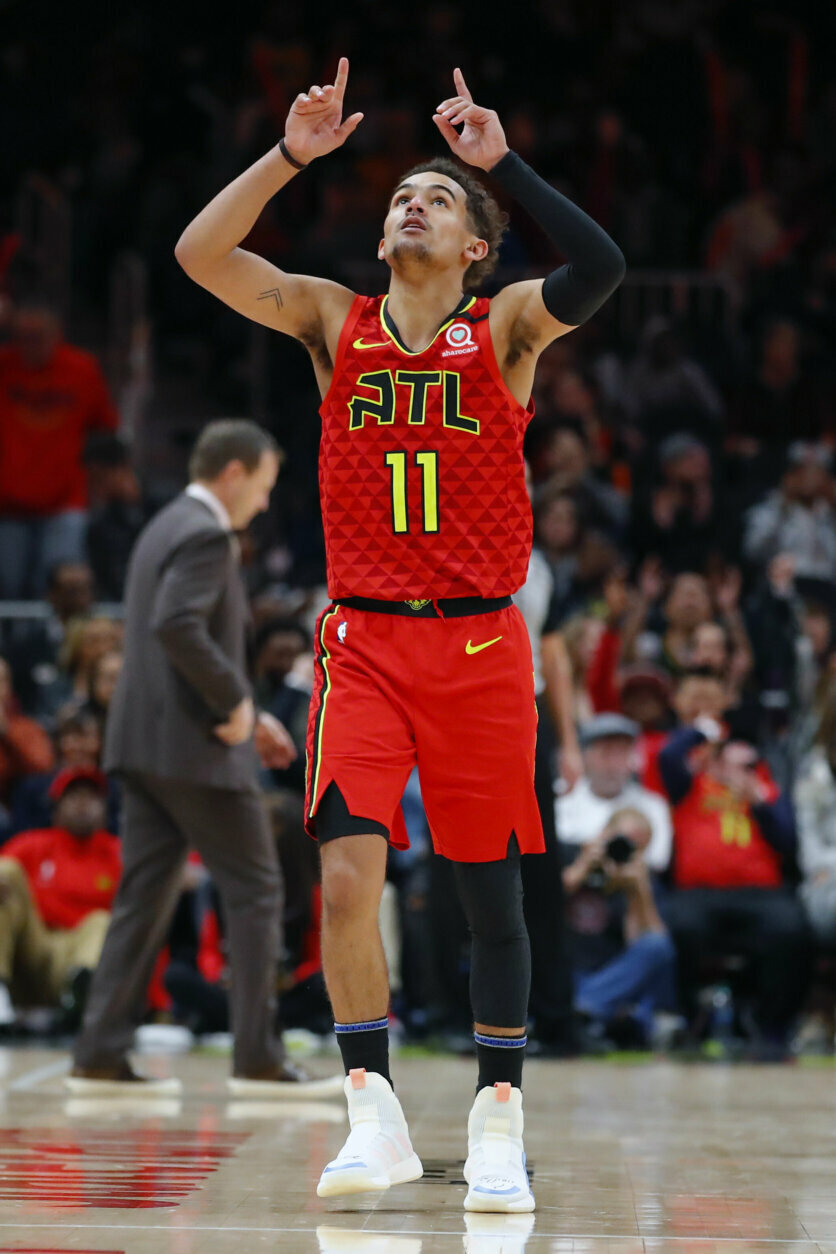 Atlanta Hawks guard Trae Young (11) reacts after landing a three pointer during the second half of an NBA basketball game against the Washington Wizards on Sunday, Jan. 26, 2020, in Atlanta. (AP Photo/Todd Kirkland)