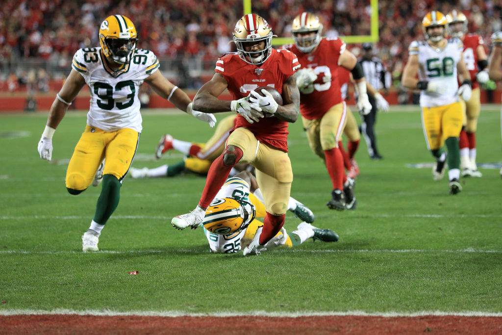 <p><b><i>Packers 20</i></b><br />
<b><i>49ers 37</i></b></p>
<p>For the <a href="https://www.espn.com/nfl/story/_/id/28477123/kyle-shanahan-tells-49ers-their-regular-season-win-packers-holds-zero-relevance-week" target="_blank" rel="noopener">second time this season</a>, San Francisco pummeled the Packers — again thanks to Robert Saleh&#8217;s defense beating up the offense designed by <a href="https://www.espn.com/nfl/story/_/id/28496309/the-best-man-battle-packers-matt-lafleur-vs-49ers-robert-saleh" target="_blank" rel="noopener">his best man Matt LaFleur</a>, making this the worst best man beating since <a href="https://www.youtube.com/watch?v=i8S97VSvbBw" target="_blank" rel="noopener">Lance&#8217;s profanity-laced beatdown of Harper in The Best Man</a>. But this game belonged to Kyle Shanahan and Raheem Mostert; the former for joining his dad, Mike, as the only father-son duo to lead teams to a Super Bowl and the latter for his <a href="https://twitter.com/ESPNStatsInfo/status/1219091595032715264?s=20" target="_blank" rel="noopener">breakout game for the ages</a>. Whether they win Super Bowl LIV or not, this is one of <a href="https://twitter.com/ESPNStatsInfo/status/1219092859208585216?s=20" target="_blank" rel="noopener">the greatest turnarounds in NFL history</a>.</p>
<p>The man with the &#8220;<a href="https://profootballtalk.nbcsports.com/2020/01/16/49ers-are-leery-of-the-aaron-rodgers-wrist-flick-from-hell/" target="_blank" rel="noopener">wrist flick from hell</a>&#8221; had the homecoming from hell, as California-native Aaron Rodgers dropped to 0-5 in his postseason career against a Top 10 pass defense and Green Bay blew the opportunity to cap the NFL&#8217;s centennial season with a rematch of the first-ever Super Bowl. Rodgers may see <a href="https://profootballtalk.nbcsports.com/2020/01/19/aaron-rodgers-this-window-is-open-for-us/" target="_blank" rel="noopener">an open window,</a> but it seems his only path to another ring will be if the Packers can assemble an unbeatable supporting cast like Denver did for Elway in the late 1990s.</p>
