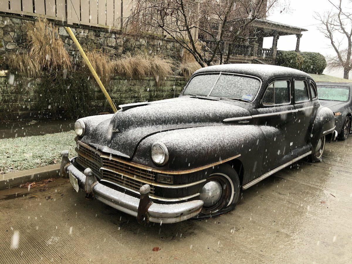 old car covered in snow