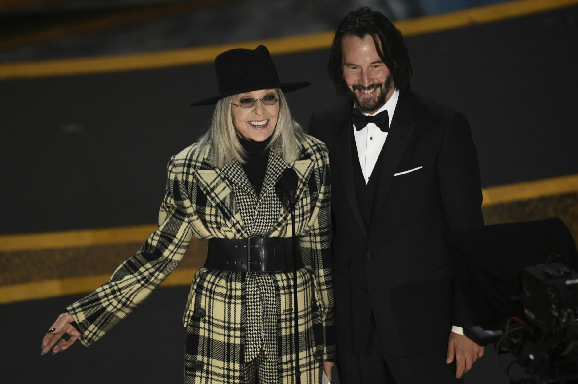 Diane Keaton, left, and Keanu Reeves appear on stage at the Oscars on Sunday, Feb. 9, 2020, at the Dolby Theatre in Los Angeles. (AP Photo/Chris Pizzello)
