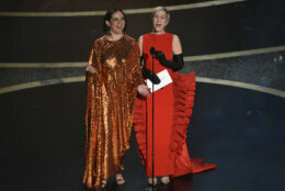 Maya Rudolph, left, and Kristen Wiig present the award for best costume design at the Oscars on Sunday, Feb. 9, 2020, at the Dolby Theatre in Los Angeles. (AP Photo/Chris Pizzello)