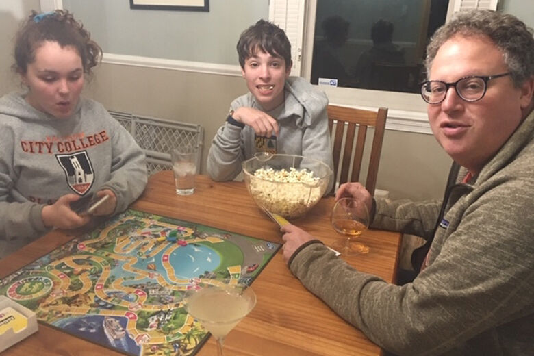 Family plays a board game.